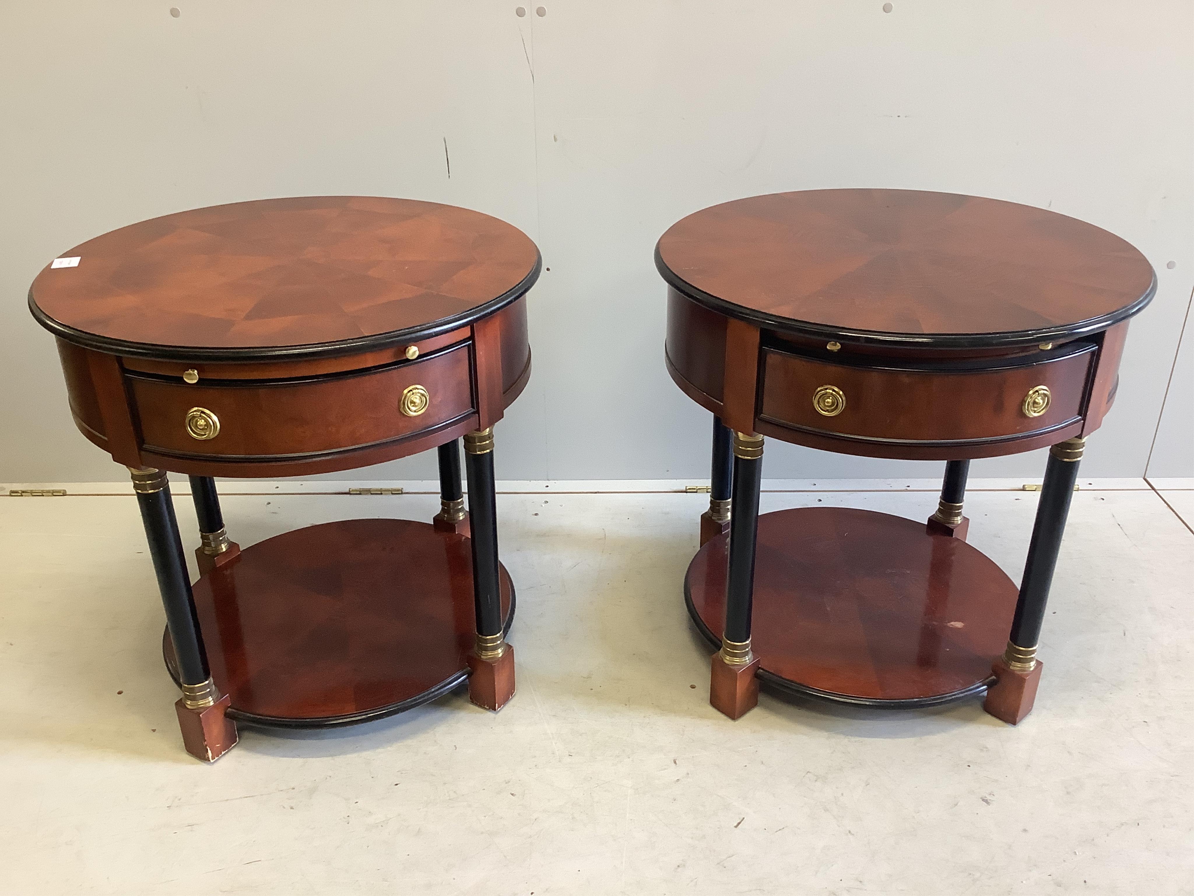 A pair of French Empire style mahogany and ebonised two tier circular tables, diameter 65cm, height 54cm. Condition - fair